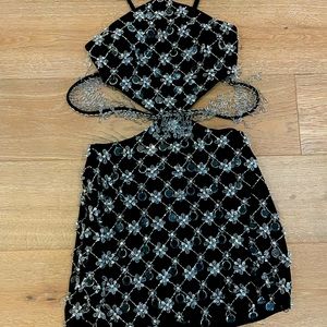 Halterneck mini dress with rhinestones and crystal beads that are hand-sewn.